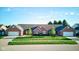 View of a well-maintained brick home with a two-car garage and green lawn at 710 Monarch Ln, Lebanon, IN 46052