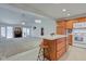 Open floor plan with spacious living room with fireplace and adjacent kitchen with island at 710 Monarch Ln, Lebanon, IN 46052
