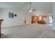 View of open living space, with living room in the foreground and the kitchen in the background at 710 Monarch Ln, Lebanon, IN 46052