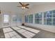Bright sunroom with multiple windows and a ceiling fan at 710 Monarch Ln, Lebanon, IN 46052