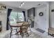 Casual dining area with a round wooden table, chairs, and a sliding door to the backyard at 7216 N Parker Ave, Indianapolis, IN 46240