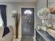 Cozy entryway with a grey front door, stylish decor, and a glimpse of the living space at 7216 N Parker Ave, Indianapolis, IN 46240