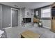 Spacious living room featuring a decorative brick fireplace, gray walls, and a comfortable seating area at 7216 N Parker Ave, Indianapolis, IN 46240