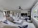 Inviting living room with a comfortable sectional sofa, large windows, and modern decor at 7216 N Parker Ave, Indianapolis, IN 46240