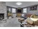 Inviting living room with gray walls, a brick fireplace, and modern decor at 7216 N Parker Ave, Indianapolis, IN 46240