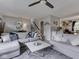 Spacious living room showcasing a large sectional sofa, a ceiling fan, and stylish decorations at 7216 N Parker Ave, Indianapolis, IN 46240