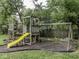 Backyard play set featuring a slide and swings, set in a wood chip safety area at 7216 N Parker Ave, Indianapolis, IN 46240