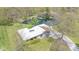 Aerial view of gray home, complete with tranquil pond and mature trees at 7310 W 100 N, Greenfield, IN 46140