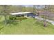 Aerial view of the home featuring well-maintained lawn and beautiful landscaping at 7310 W 100 N, Greenfield, IN 46140