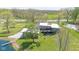 Aerial view of a gray house with pond and expansive lawn at 7310 W 100 N, Greenfield, IN 46140