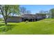 View of modern house showcasing walkout deck and backyard at 7310 W 100 N, Greenfield, IN 46140