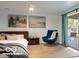 Bedroom featuring a ceiling fan, modern art, and access to outdoor patio at 7310 W 100 N, Greenfield, IN 46140