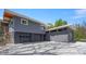 Modern home exterior featuring a three-car garage at 7310 W 100 N, Greenfield, IN 46140