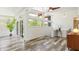 Sun-filled living room boasts a wall of windows, natural light, and neutral walls at 7310 W 100 N, Greenfield, IN 46140