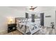 Cozy main bedroom showcases a comfortable bed, modern ceiling fan, and ample natural light at 7310 W 100 N, Greenfield, IN 46140