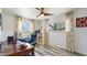 Comfortable home office with natural light, hardwood floors, and plenty of space for working at 7310 W 100 N, Greenfield, IN 46140