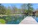 Scenic pond view with a charming wooden dock at 7310 W 100 N, Greenfield, IN 46140