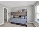 Bedroom featuring a bunk bed with storage and carpeted floors at 7645 Marin Pkwy, Cumberland, IN 46229