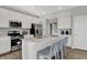 Spacious kitchen with stainless steel appliances and a large center island with seating at 7657 Marin Pkwy, Cumberland, IN 46229