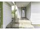 View of a back porch with steps, showing some damage at 7702 Mary Ln, Indianapolis, IN 46217