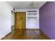 Bedroom featuring hardwood floors, a closet and shelving; ready for personalization at 7702 Mary Ln, Indianapolis, IN 46217
