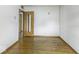 Empty bedroom with wood floors and plenty of sunlight at 7702 Mary Ln, Indianapolis, IN 46217