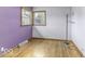 Sunlit bedroom boasts gleaming hardwood floors and ample natural light at 7702 Mary Ln, Indianapolis, IN 46217