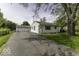 Traditional one-story home with attached two car garage, and paved driveway at 7702 Mary Ln, Indianapolis, IN 46217