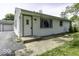 Close up of the front entrance of a single story home with white siding at 7702 Mary Ln, Indianapolis, IN 46217