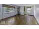Bright living room with large windows and gleaming hardwood floors at 7702 Mary Ln, Indianapolis, IN 46217