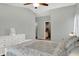 Well-lit bedroom featuring a ceiling fan, a closet, and comfortable bedroom furniture at 8120 Glenwillow Ln # 206, Indianapolis, IN 46278