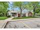 Charming clubhouse, featuring classic brick and siding, with a well-maintained lawn and ample parking at 8120 Glenwillow Ln # 206, Indianapolis, IN 46278