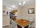 Well-lit dining room is adjacent to the kitchen, offering a seamless transition for entertaining and everyday living at 8120 Glenwillow Ln # 206, Indianapolis, IN 46278