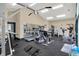 Bright and airy gym equipped with treadmills, weight machines, and mirrored walls at 8120 Glenwillow Ln # 206, Indianapolis, IN 46278