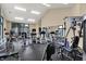Well-equipped gym featuring a variety of fitness equipment and ample natural light at 8120 Glenwillow Ln # 206, Indianapolis, IN 46278