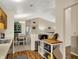 Open-concept kitchen showcasing a view to the dining and living areas at 8120 Glenwillow Ln # 206, Indianapolis, IN 46278