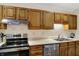 Updated kitchen features modern appliances, light countertops, and efficient layout at 8120 Glenwillow Ln # 206, Indianapolis, IN 46278