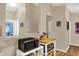 Kitchen view featuring stainless appliances, and a passthrough to other rooms at 8120 Glenwillow Ln # 206, Indianapolis, IN 46278