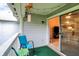 Charming covered patio with comfortable seating and seamless indoor-outdoor flow via sliding doors at 8120 Glenwillow Ln # 206, Indianapolis, IN 46278