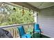 Relaxing patio with chairs, table, and pleasant natural surroundings provides a peaceful escape at 8120 Glenwillow Ln # 206, Indianapolis, IN 46278