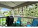 Cozy covered patio with grill, seating, and serene views of the lush surrounding greenery at 8120 Glenwillow Ln # 206, Indianapolis, IN 46278