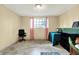 Basement room featuring a window, tile flooring, and neutral-colored walls at 831 Wakulla Ct, Indianapolis, IN 46217