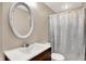Bathroom with a vanity, mirror, toilet, and shower with a curtain at 831 Wakulla Ct, Indianapolis, IN 46217