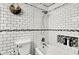Clean bathroom design with subway tile, bathtub, and built-in niche at 831 Wakulla Ct, Indianapolis, IN 46217