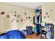 Bright, sport-themed bedroom with ample closet space and natural light at 831 Wakulla Ct, Indianapolis, IN 46217