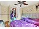 Bedroom with two beds, closet, and butterfly-themed decor at 831 Wakulla Ct, Indianapolis, IN 46217