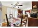 Comfortable dining area with dark cabinets, table set, and an open layout at 831 Wakulla Ct, Indianapolis, IN 46217