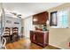 Bright dining area with dark cabinetry, hardwood floors, and natural light at 831 Wakulla Ct, Indianapolis, IN 46217