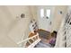 View of the home's entrance foyer showcasing the door, stairs, and modern decor at 831 Wakulla Ct, Indianapolis, IN 46217