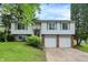 Two-story home featuring a front-facing two-car garage and well-maintained landscaping at 831 Wakulla Ct, Indianapolis, IN 46217